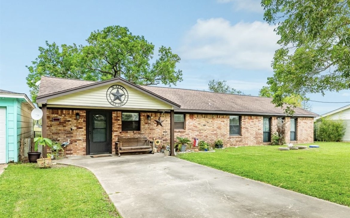 131 Bastrop Bayou Drive Angleton, TX 77515 - Photo 5 of 36 front view of a house with a yard