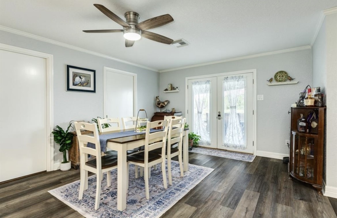 131 Bastrop Bayou Drive Angleton, TX 77515 - Photo 10 of 36 a view of a dining room with furniture and wooden floor