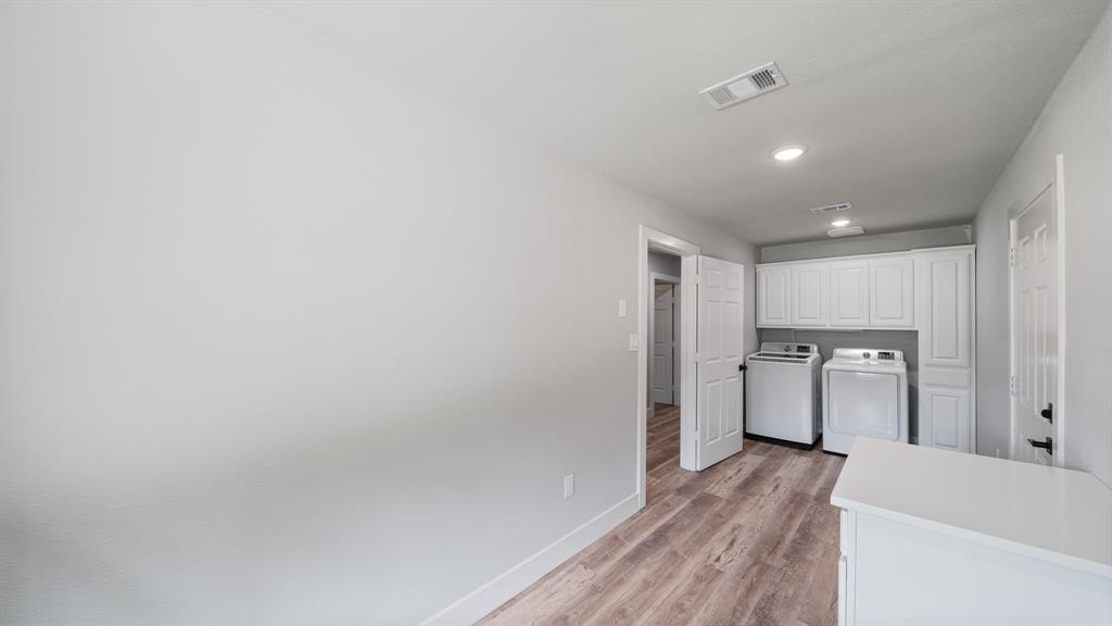 129 King Arthur Road Mabank, TX 75156 - Photo 13 of 33 a view of a kitchen with a sink and a refrigerator