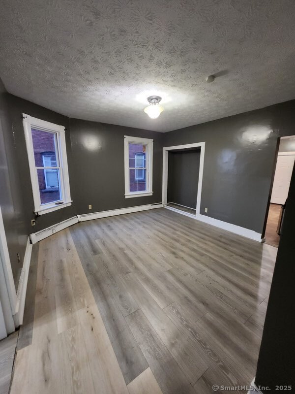 199 Jefferson Street Hartford, CT 06106 - Photo 8 of 9 an empty room with windows