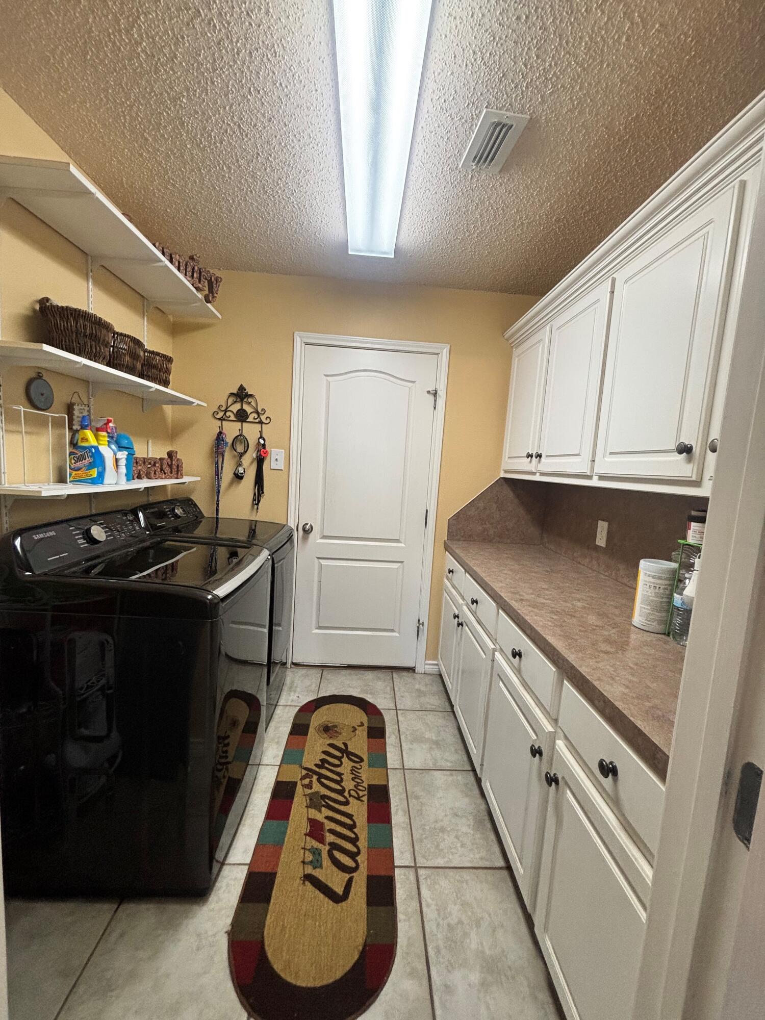 3713 106th Street Lubbock, TX 79423 - Photo 19 of 22 a kitchen with granite countertop a sink stove and cabinets