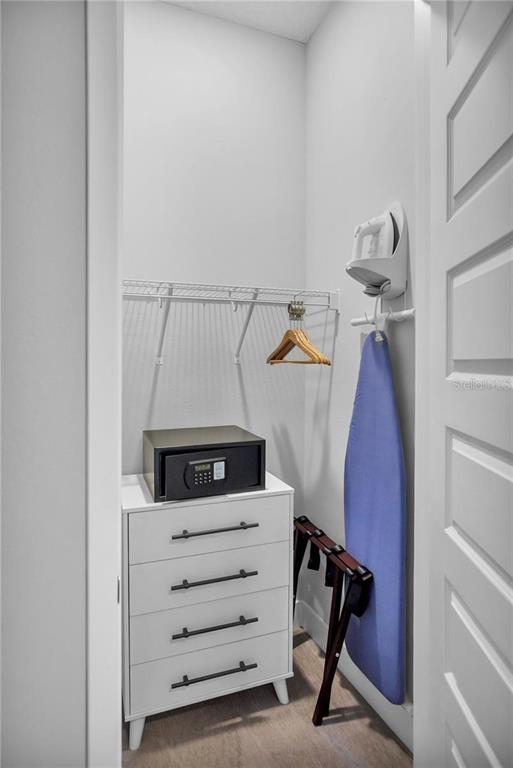 7740 Sandy Ridge Drive, Unit 106 Reunion, FL 34747 - Photo 24 of 43 a view of walk in closet with clothes and shoes