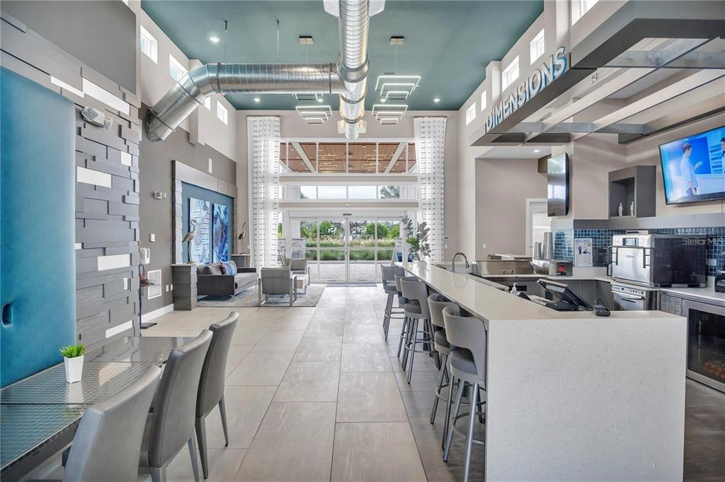 7740 Sandy Ridge Drive, Unit 106 Reunion, FL 34747 - Photo 35 of 43 a view of a dining room with furniture window and outside view