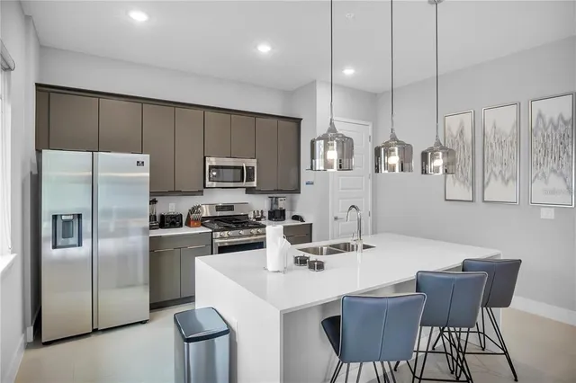 a kitchen that has a sink and a stove