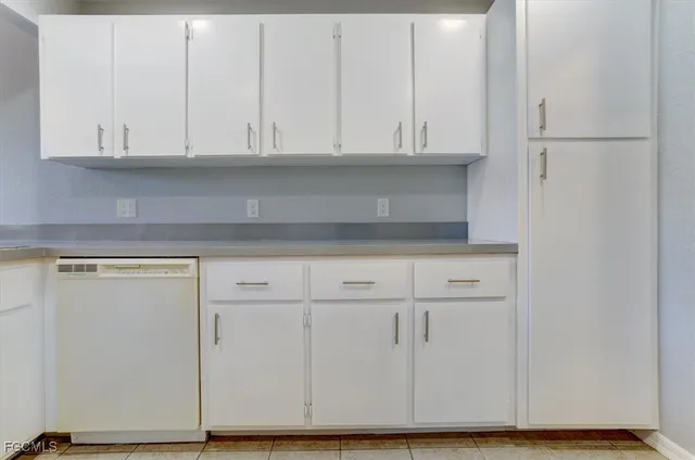 a view of cabinets and wooden floor