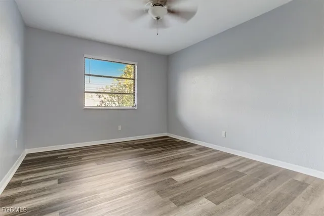 a view of an empty room with a window