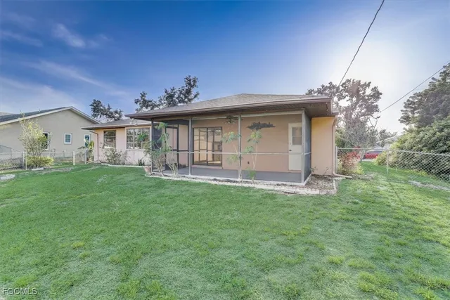 a view of a house with a backyard