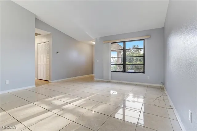 a view of an empty room with a window