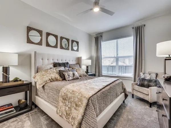 a bedroom with bed and a window