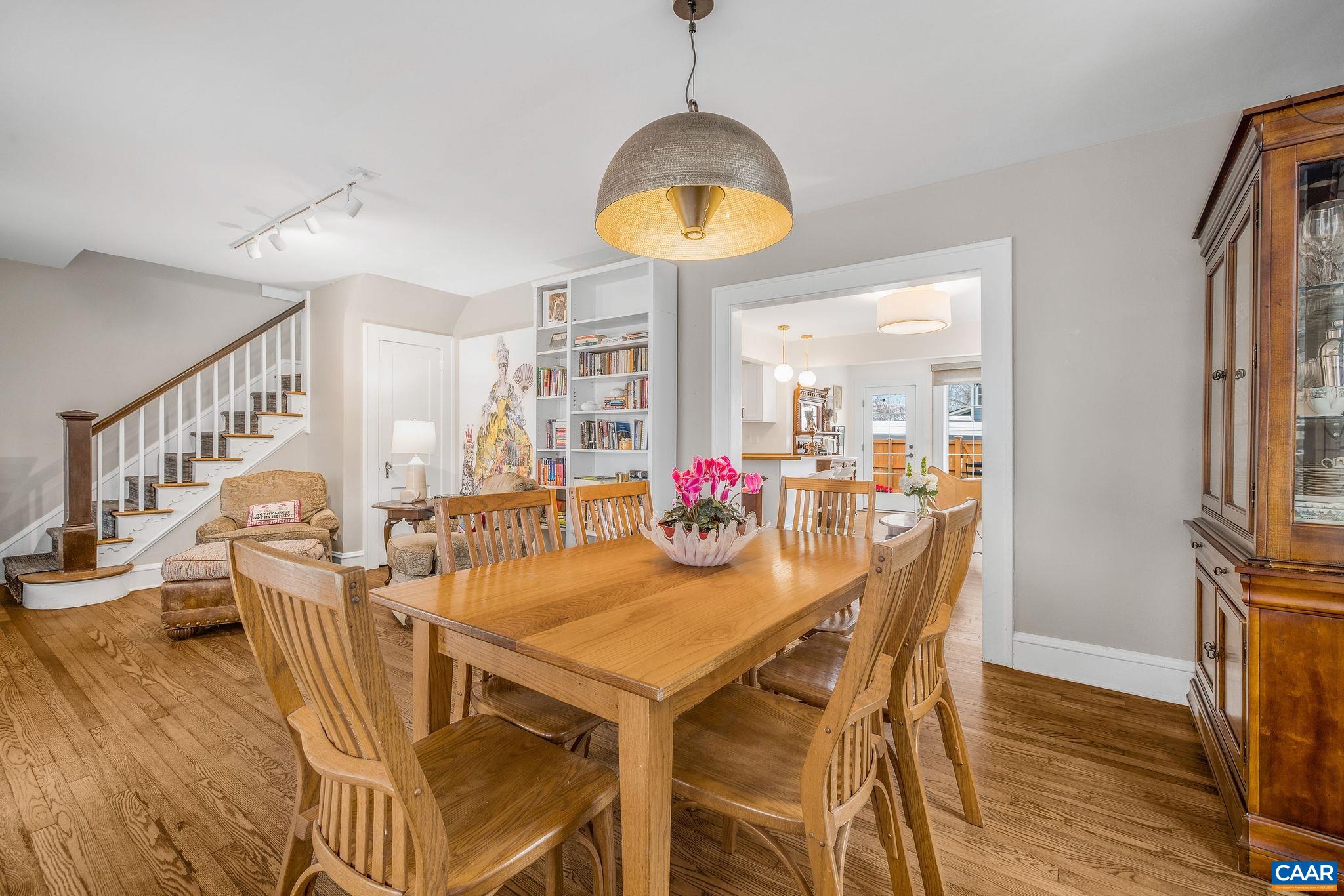 1105 Avon Street Charlottesville, VA 22902 - Photo 14 of 42 a view of a dining room with furniture and a chandelier