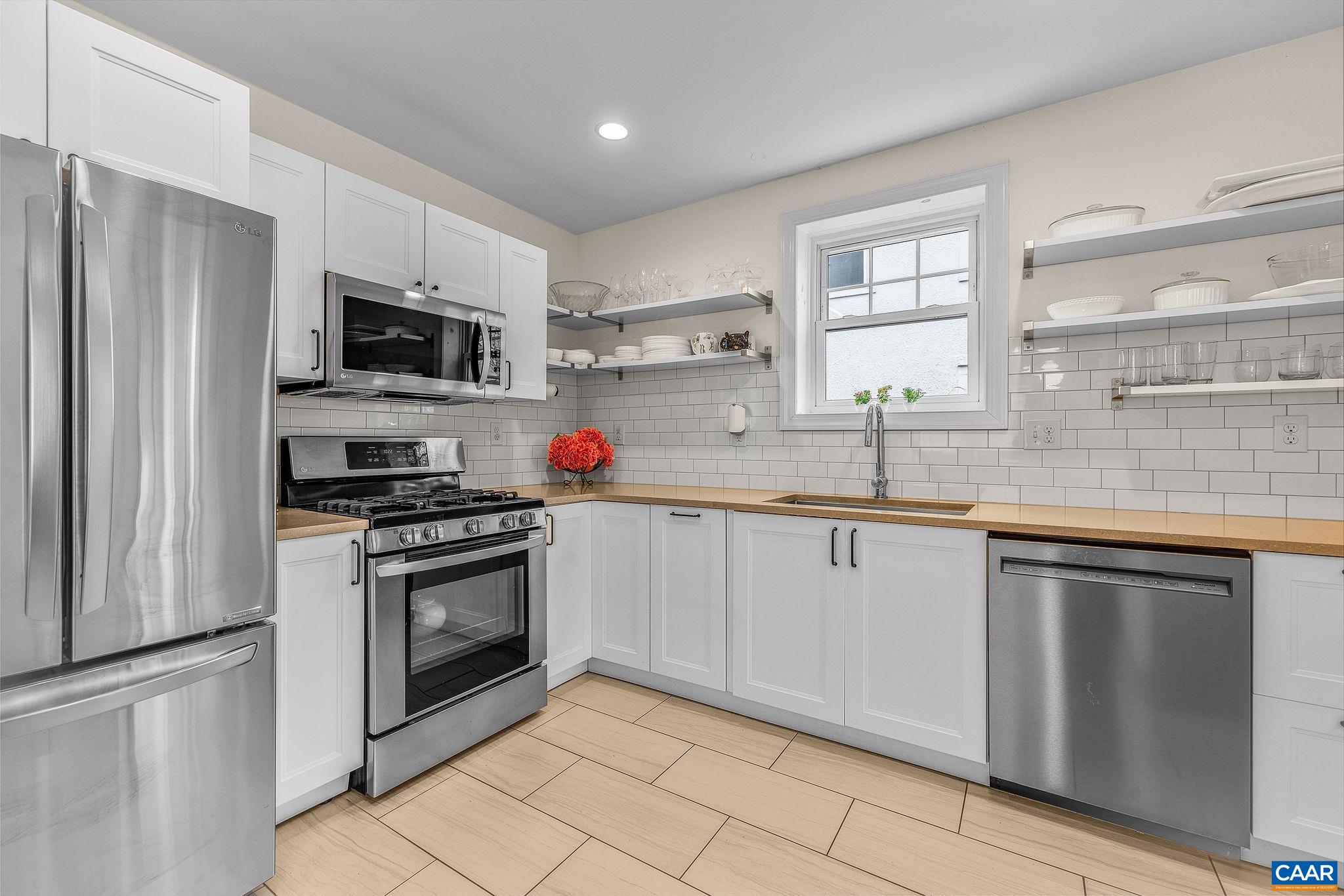 1105 Avon Street Charlottesville, VA 22902 - Photo 21 of 42 a kitchen with stainless steel appliances granite countertop a sink and cabinets