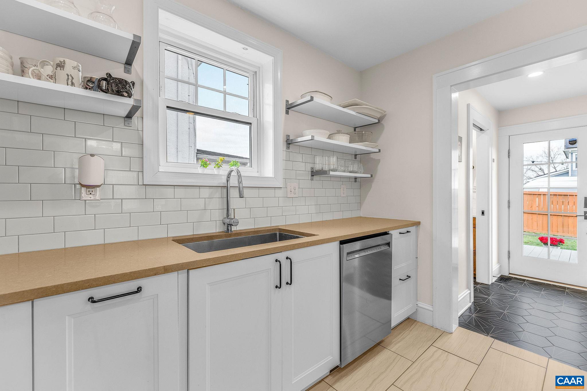 1105 Avon Street Charlottesville, VA 22902 - Photo 24 of 42 a kitchen with a sink cabinets and a window