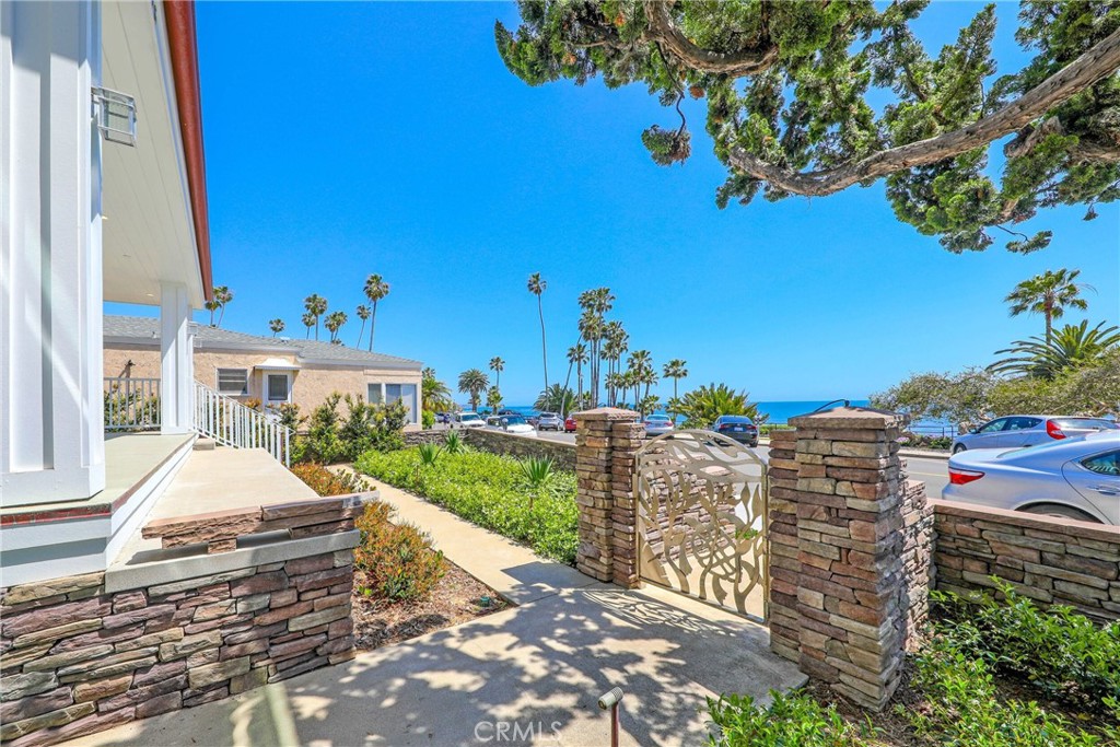 376 Cliff Drive, Unit C Laguna Beach, CA 92651 - Photo 16 of 22 a front view of a house with a yard