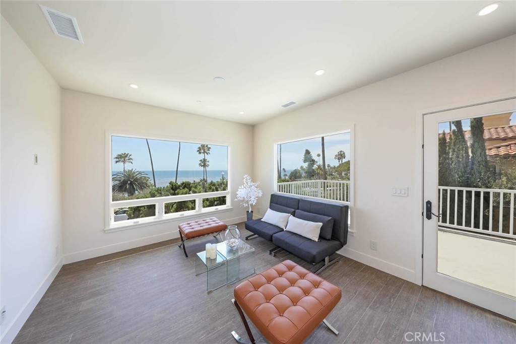 376 Cliff Drive, Unit C Laguna Beach, CA 92651 - Photo 3 of 22 a living room with furniture and a window