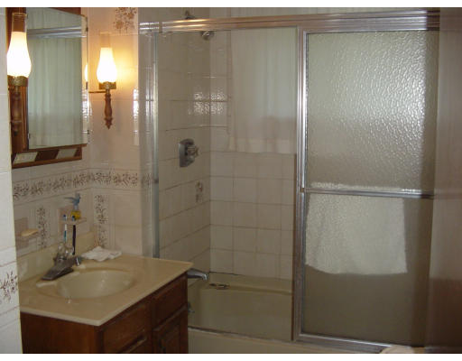 45 Endecott Street Springfield, MA 01118 - Photo 21 of 28 a bathroom with a sink and mirror