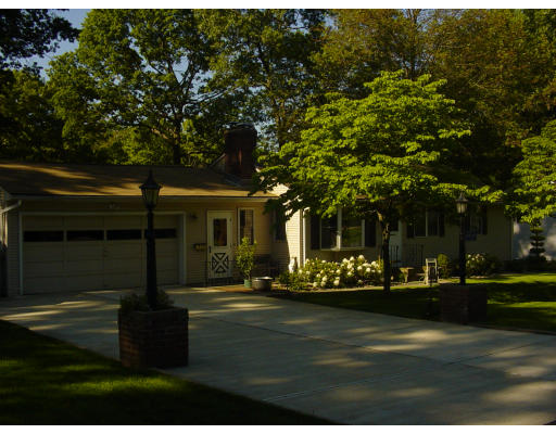 45 Endecott Street Springfield, MA 01118 - Photo 3 of 28 a front view of a house with a yard