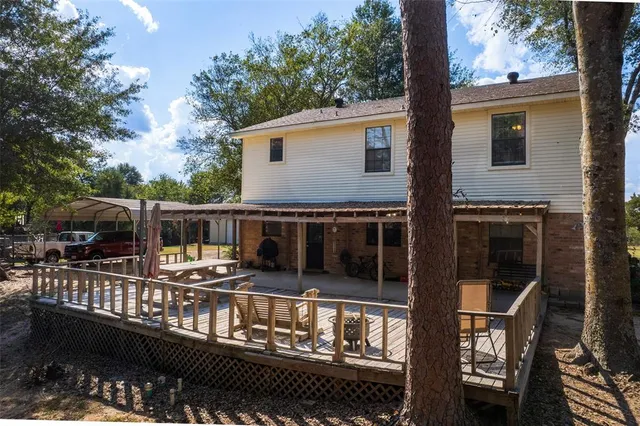 a view of a swimming pool with a house in the background