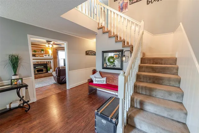 a view of entryway and hall with wooden floor