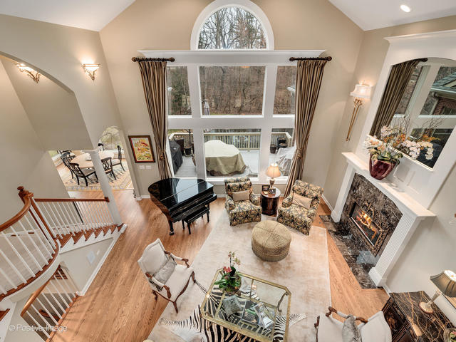 20 Ashton Drive Burr Ridge, IL 60527 - Photo 13 of 59 a view of a dining room with furniture a chandelier and wooden floor