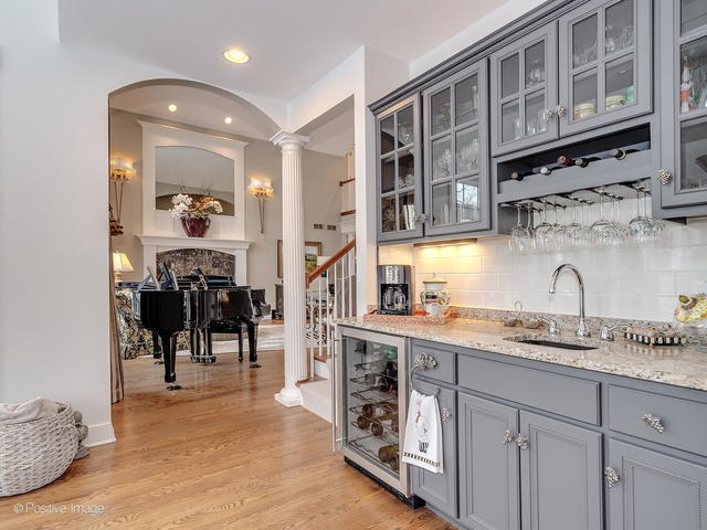 20 Ashton Drive Burr Ridge, IL 60527 - Photo 19 of 59 a kitchen with stainless steel appliances granite countertop a sink and cabinets