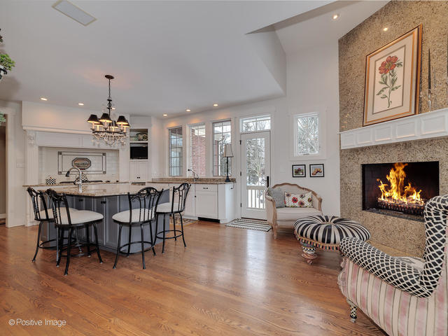 20 Ashton Drive Burr Ridge, IL 60527 - Photo 20 of 59 a living room with furniture a fireplace and kitchen view