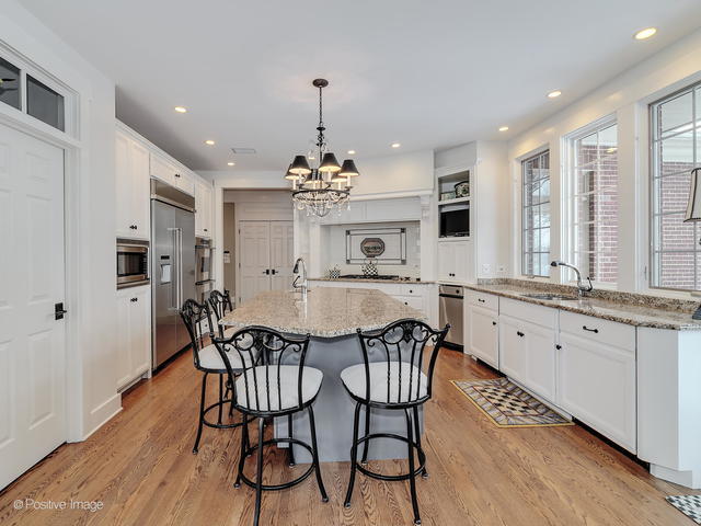 20 Ashton Drive Burr Ridge, IL 60527 - Photo 24 of 59 a view of a dining room with furniture window and wooden floor