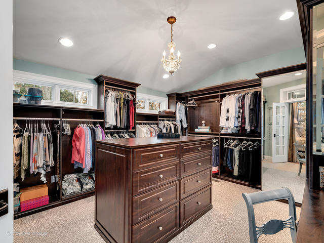 20 Ashton Drive Burr Ridge, IL 60527 - Photo 28 of 59 a kitchen with stainless steel appliances granite countertop a refrigerator and a stove top oven