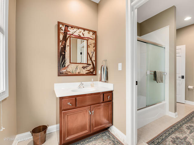 20 Ashton Drive Burr Ridge, IL 60527 - Photo 36 of 59 a bathroom with a sink a toilet and shower