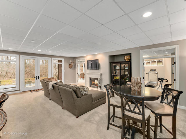 20 Ashton Drive Burr Ridge, IL 60527 - Photo 37 of 59 a living room with furniture and a floor to ceiling window