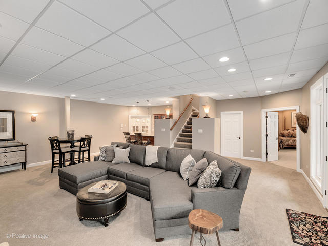 20 Ashton Drive Burr Ridge, IL 60527 - Photo 39 of 59 a living room with furniture and a wooden floor