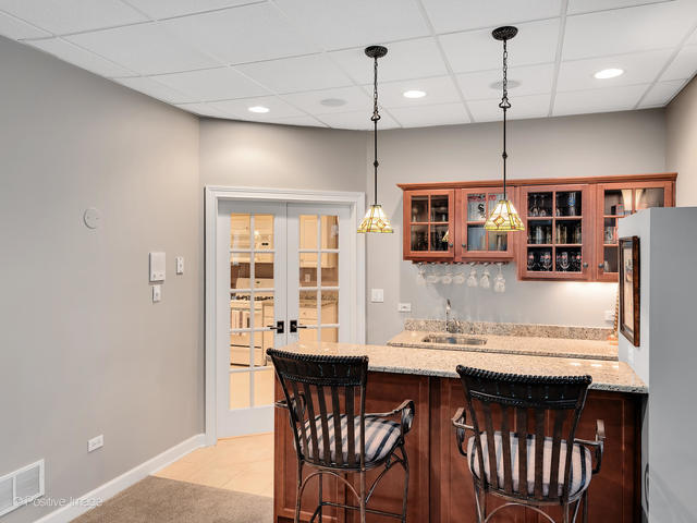 20 Ashton Drive Burr Ridge, IL 60527 - Photo 41 of 59 a kitchen with a table and chairs in it