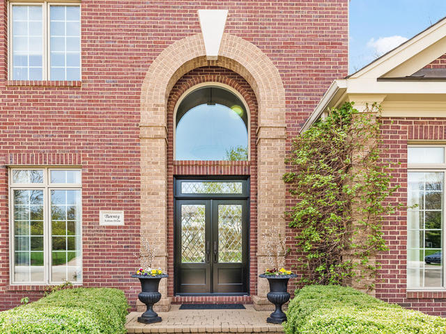 20 Ashton Drive Burr Ridge, IL 60527 - Photo 6 of 59 a front view of a house with a garden