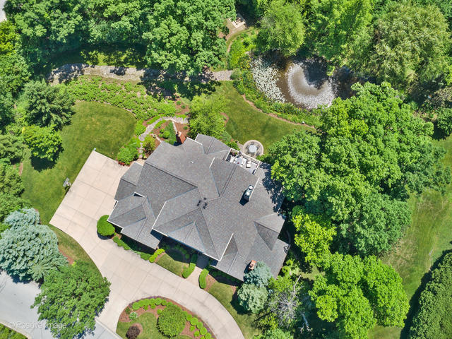 20 Ashton Drive Burr Ridge, IL 60527 - Photo 51 of 59 an aerial view of a house with a yard and large trees