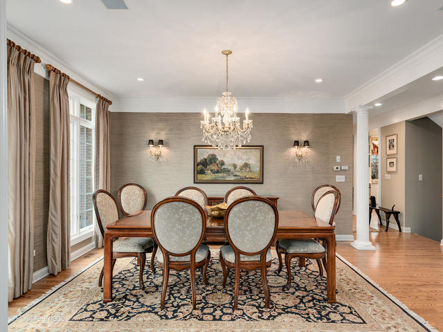20 Ashton Drive Burr Ridge, IL 60527 - Photo 9 of 59 a view of a dining room with furniture chandelier and wooden floor