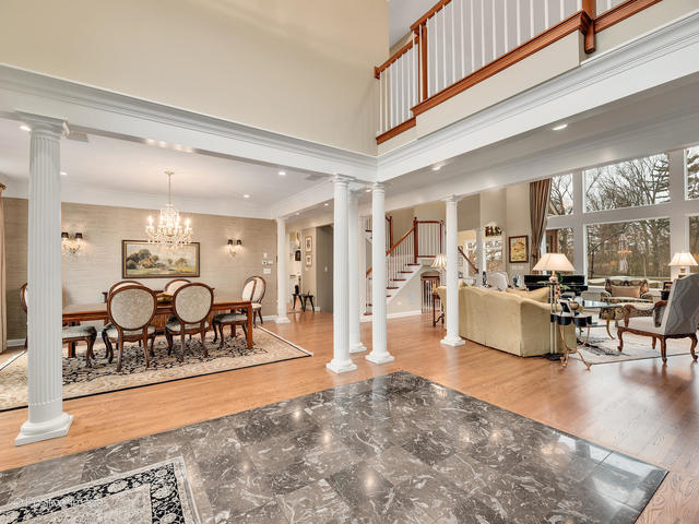 20 Ashton Drive Burr Ridge, IL 60527 - Photo 10 of 59 a living room with furniture a rug and a large window