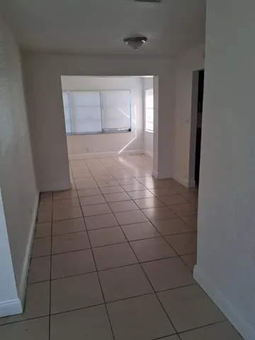 a view of a livingroom with an empty space and a sink