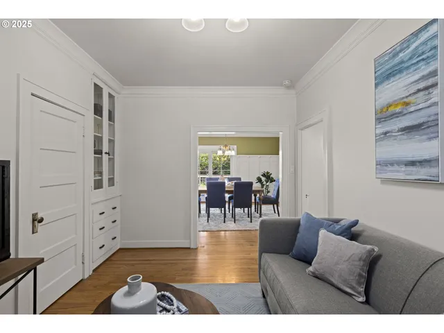 a kitchen with a potted plant on the counter and cabinets