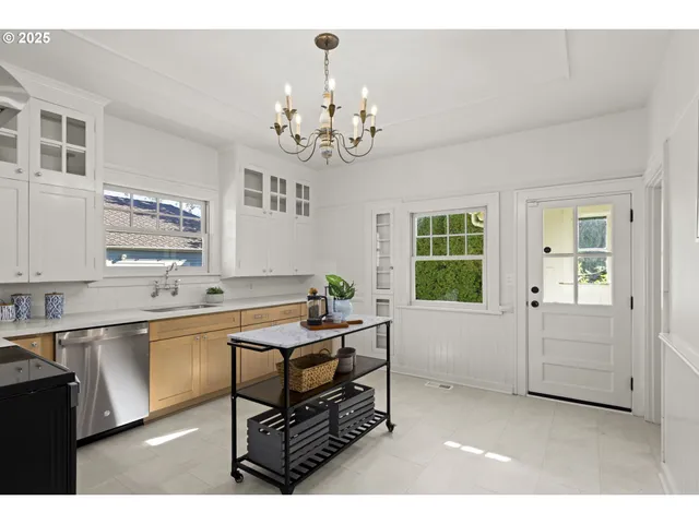 a kitchen with a sink and cabinets