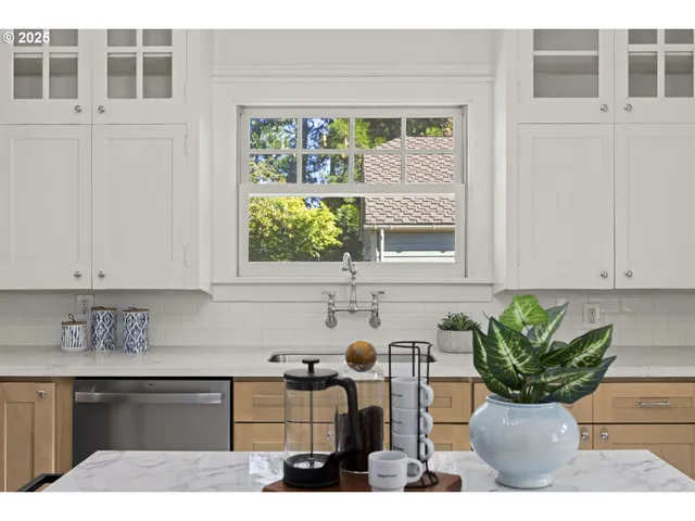 a kitchen that has a lot of cabinets in it