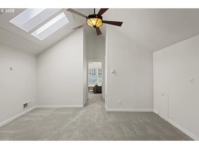 a bedroom with furniture and a large window