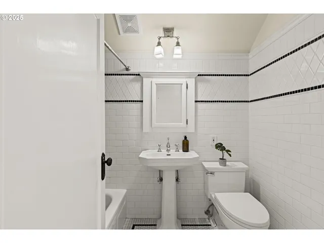 a view of wooden floor and windows in a room