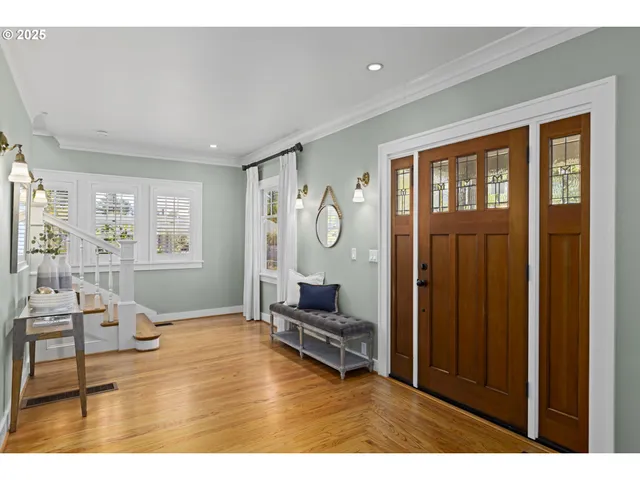 a view of a dining room with furniture wooden floor and chandelier