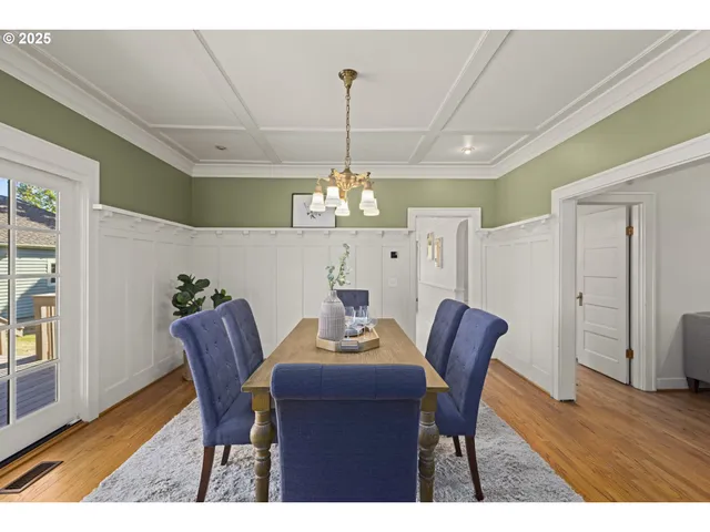 a living room with furniture a flat screen tv and a window