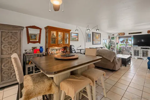 a kitchen with granite countertop a sink and cabinets
