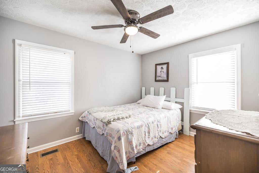 188 Lewis Street Cochran, GA 31014 - Photo 14 of 46 a bedroom with a bed and window