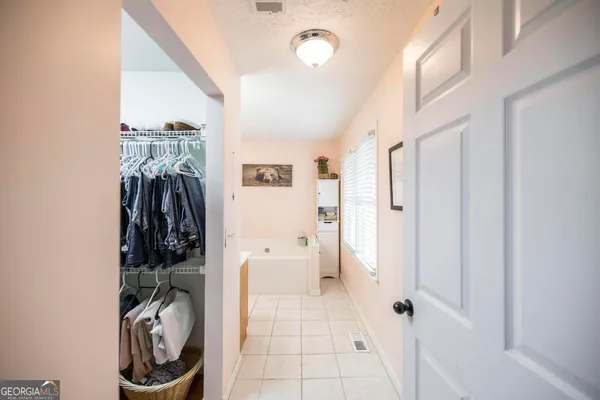 a bathroom with a bathtub and a sink