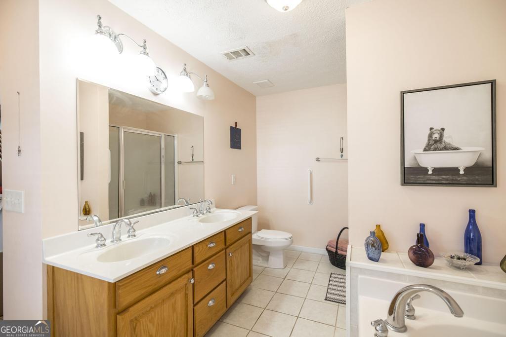 188 Lewis Street Cochran, GA 31014 - Photo 21 of 46 a bathroom with a sink and a mirror