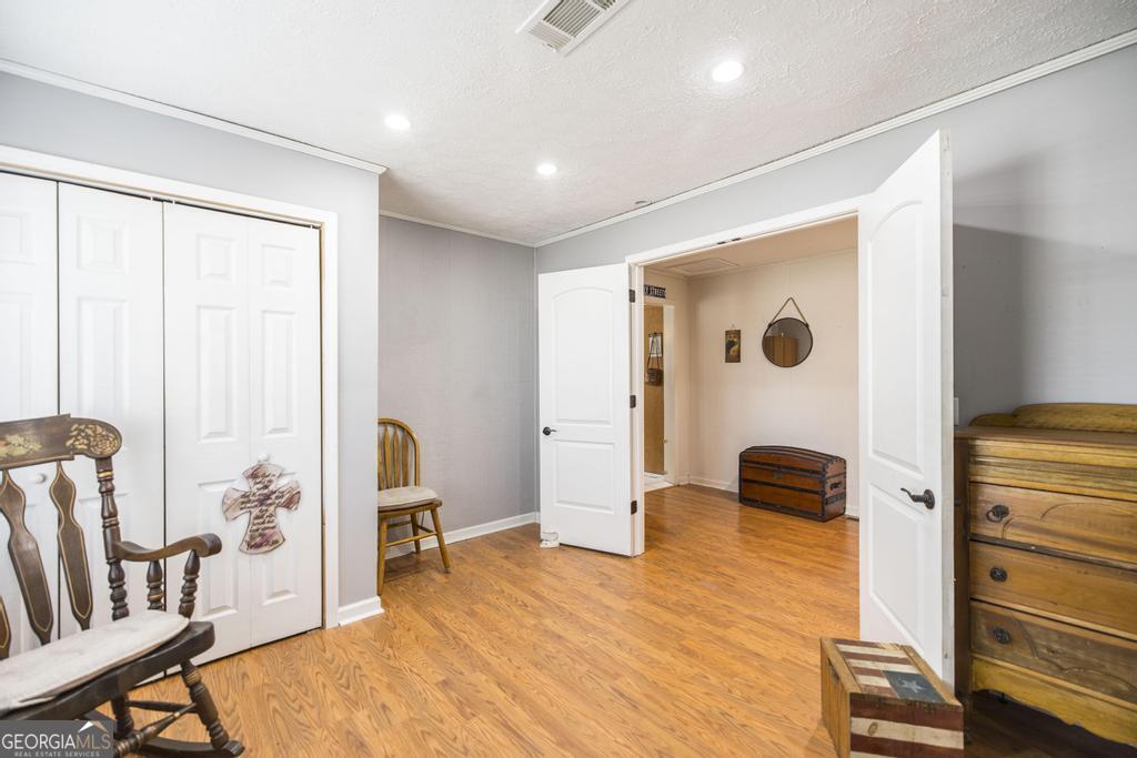 188 Lewis Street Cochran, GA 31014 - Photo 24 of 46 a view of room with furniture and wooden floor