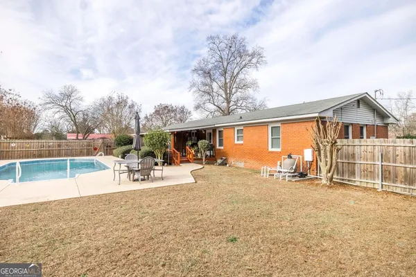 a view of a house with swimming pool