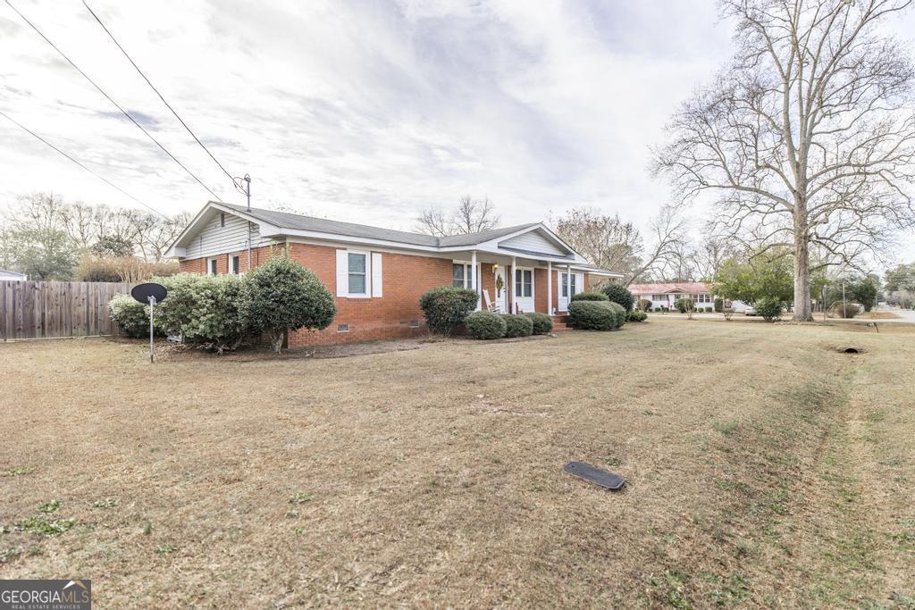 188 Lewis Street Cochran, GA 31014 - Photo 35 of 46 a view of house with yard and plants